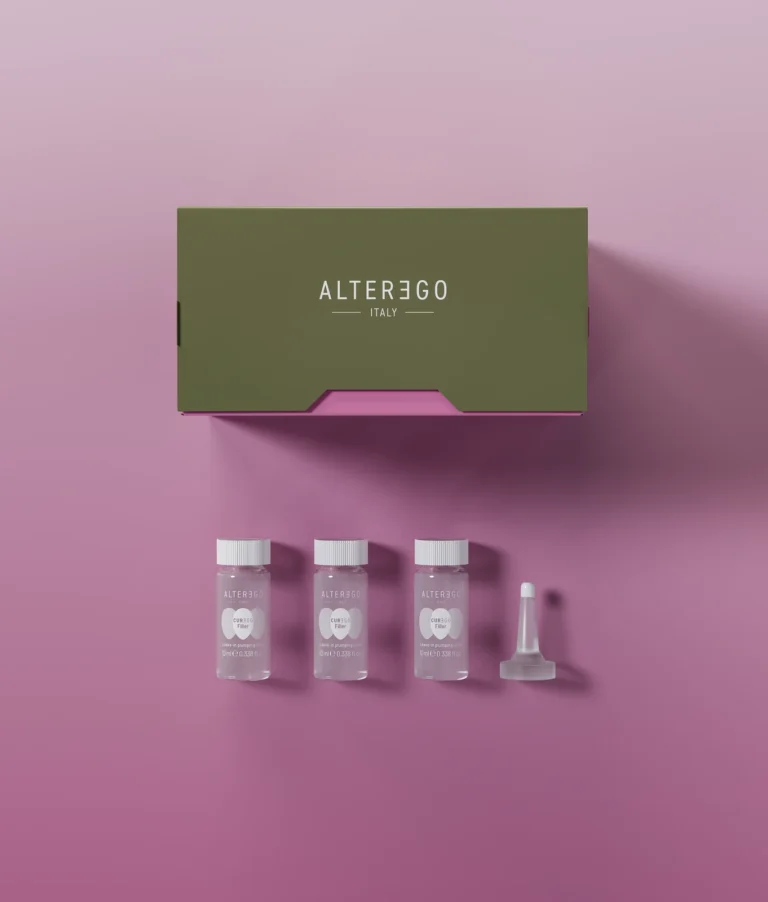 Curego Filler Lotion set with three small bottles and an applicator on pink background.