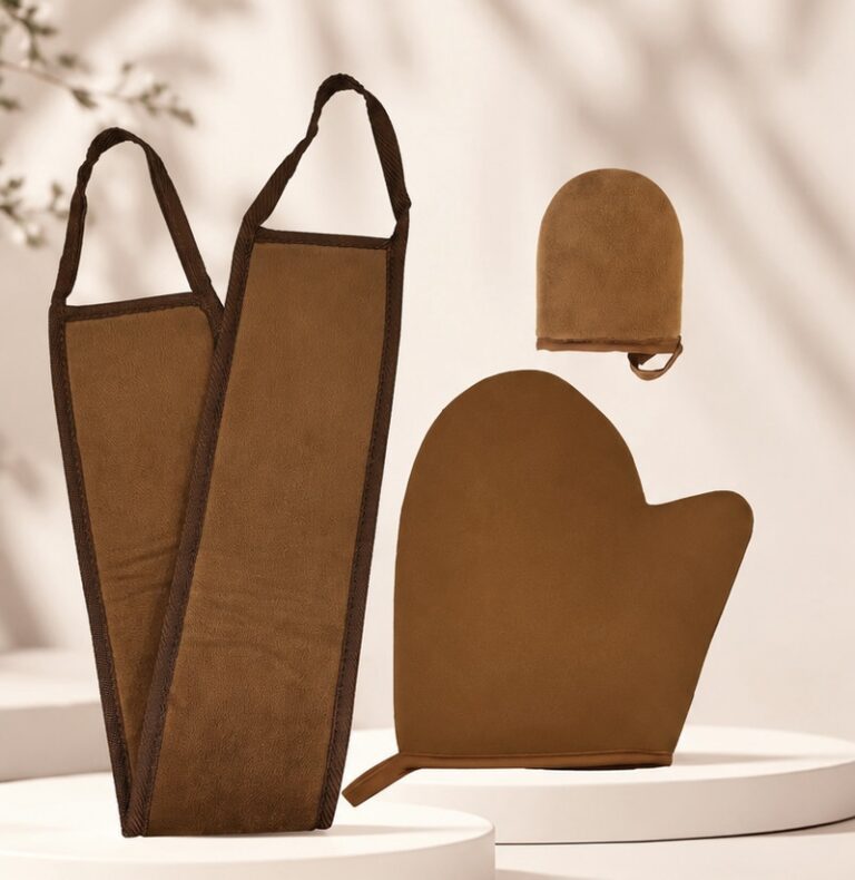 Brown exfoliating mitt set displayed on white surfaces.