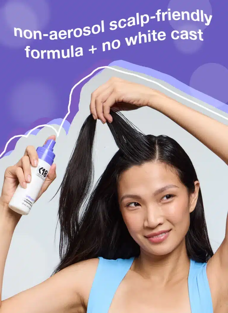 Woman applying non-aerosol hair product; text reads "non-aerosol scalp-friendly formula + no white cast."