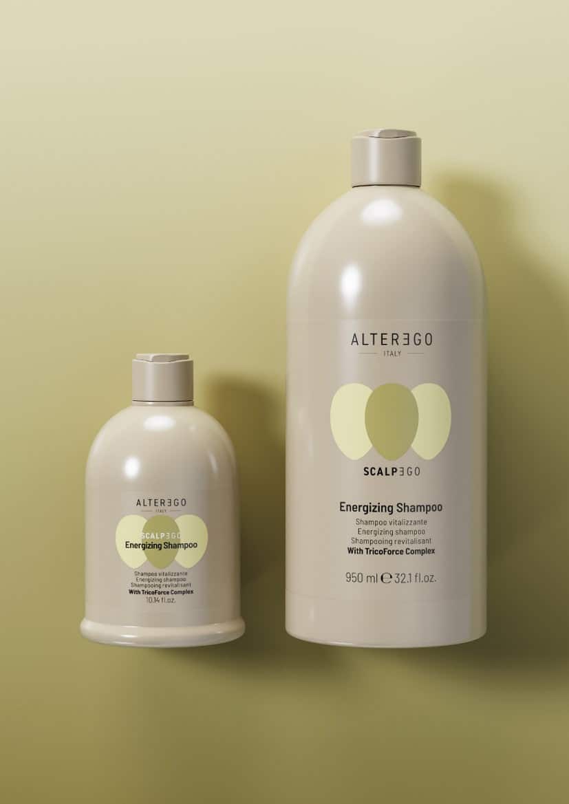 Two bottles of Alter Ego Italy Energizing Shampoo on a light green background.